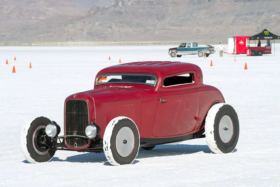 Red hot rod sitting on the salt flats