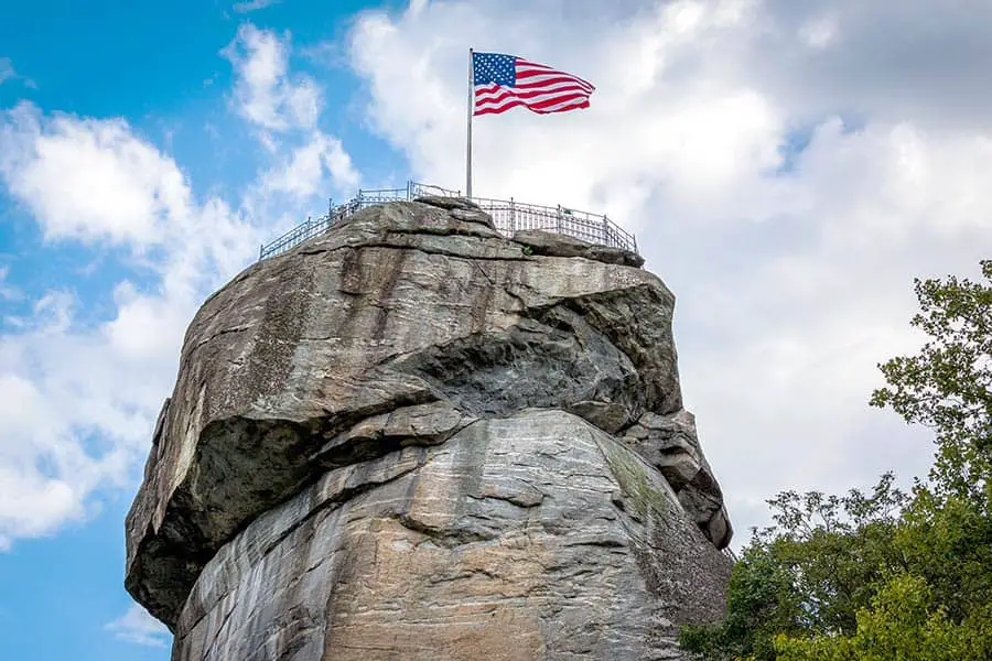 American flag on top of tall granite monolith in North Carolina