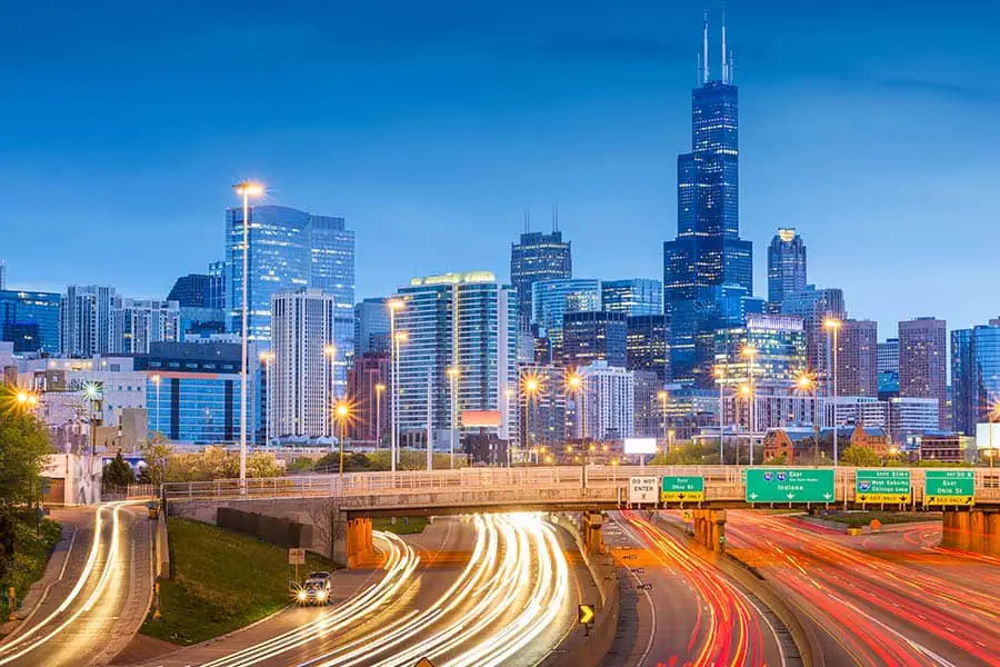 Time lapse of cars on busy highway heading into Chicago