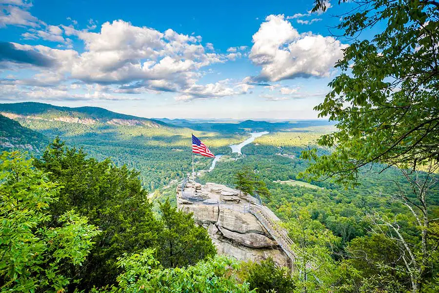 Overview of Chimney Rock a large granite outcropping high above the forested valley floor in North Carolina