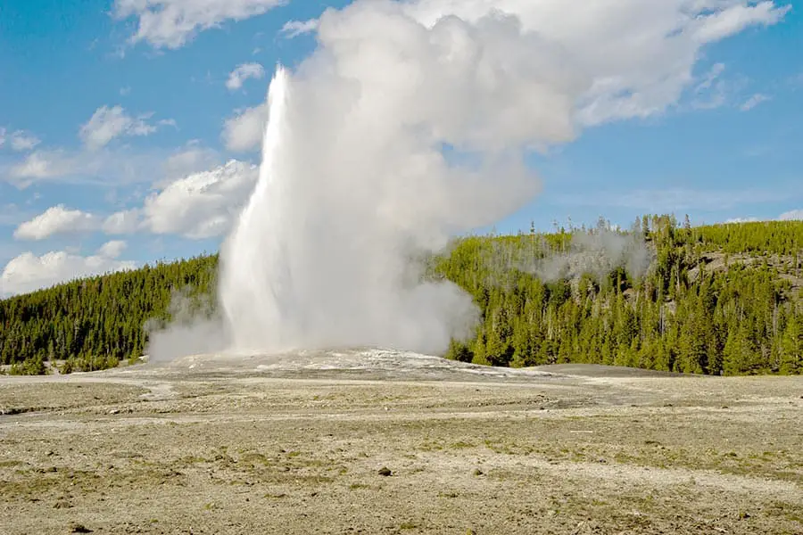 Old Faithful geyser spewing water high into the air