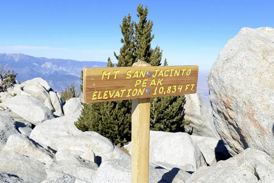 Mt San Jacinto summit sign surrounded by boulders, elevation 10,834 feet