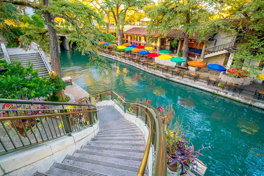 Stairs lead down to the Riverwalk, a lively San Antonio, Texas tourist attraction