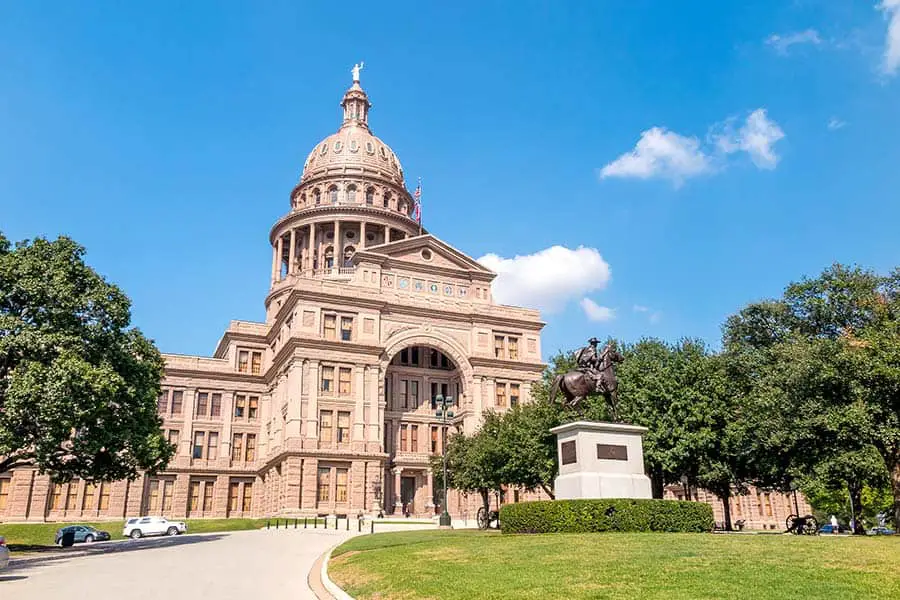 State Capitol building Austin Texas with a bronze statue of a horse and rider