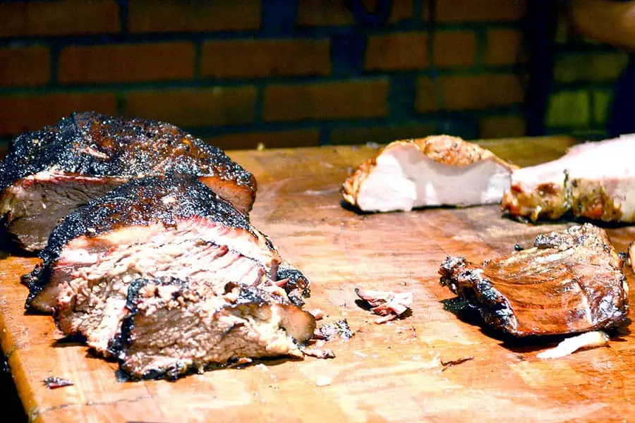 Smoked barbecue beef ribs on wooden cutting board