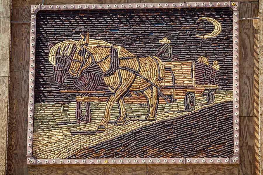 Mural depicting horse pulling wagon using different colored corn in South Dakota