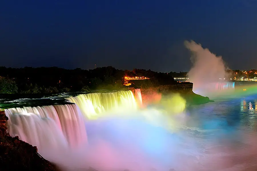 Niagara Falls lit with rainbow of colors at night